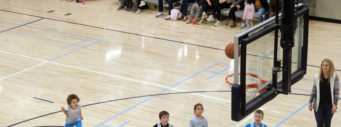Youth basketball game between David B Waymer Recreation Center team and Northern Regional Recreation Center team at NRRC
