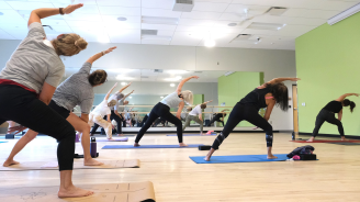 Northern Recreation Center visitors taking a yoga class.