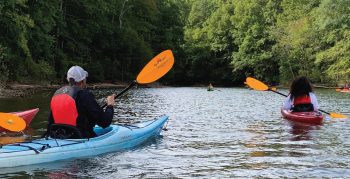Park and Recreation visual guidelines cover of two individuals canoeing.