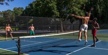 People playing pickleball at Enderly Park on a sunny day.