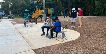 Two people playing chess at Fred Alexander Park