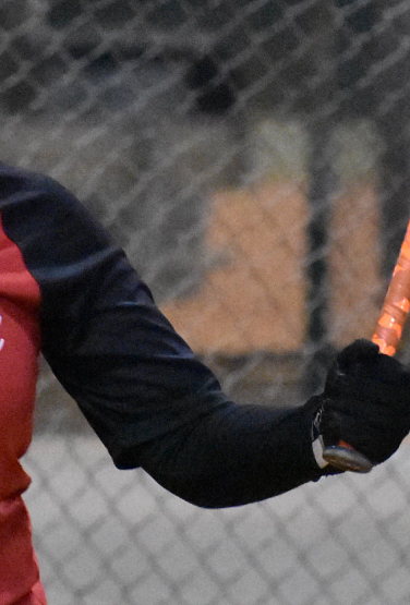 Woman swinging her bat.